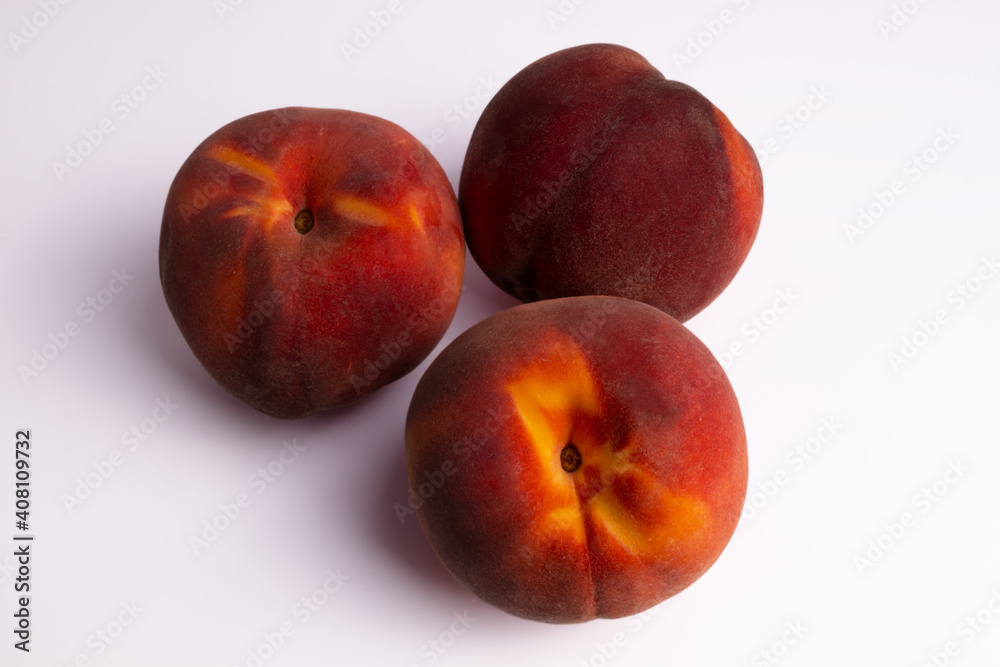 three red with yellow streaked peach top view three red with yellow streaked peach top view