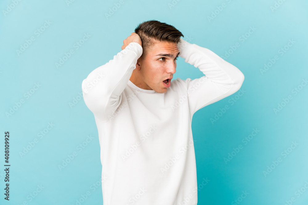Young caucasian handsome man isolated screaming, very excited, passionate, satisfied with something. Young caucasian handsome man isolated screaming, very excited, passionate, satisfied with something.