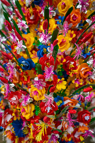 Fototapeta Naklejka Na Ścianę i Meble -  paper flowers as a background or decor. Traditional decoration for event or holidays in Vietnam.
