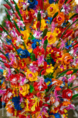 paper flowers as a background or decor. Traditional decoration for event or holidays in Vietnam. © CravenA
