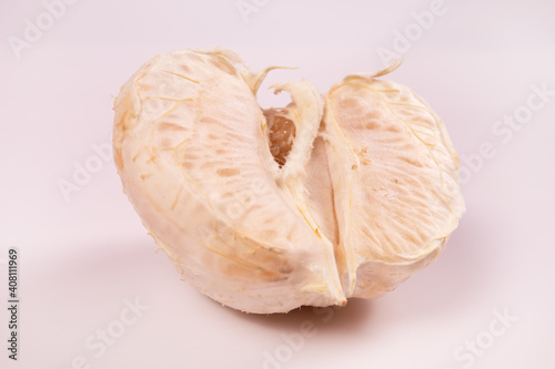 a close-up view of half a peeled mandarin