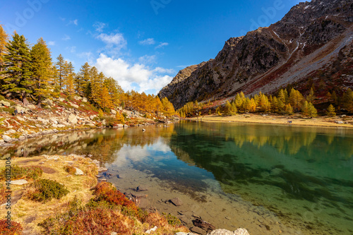 Arpy Lake and the surrounding area during the fall and changing of the colors. Foliage  reflection and snowy peaks
