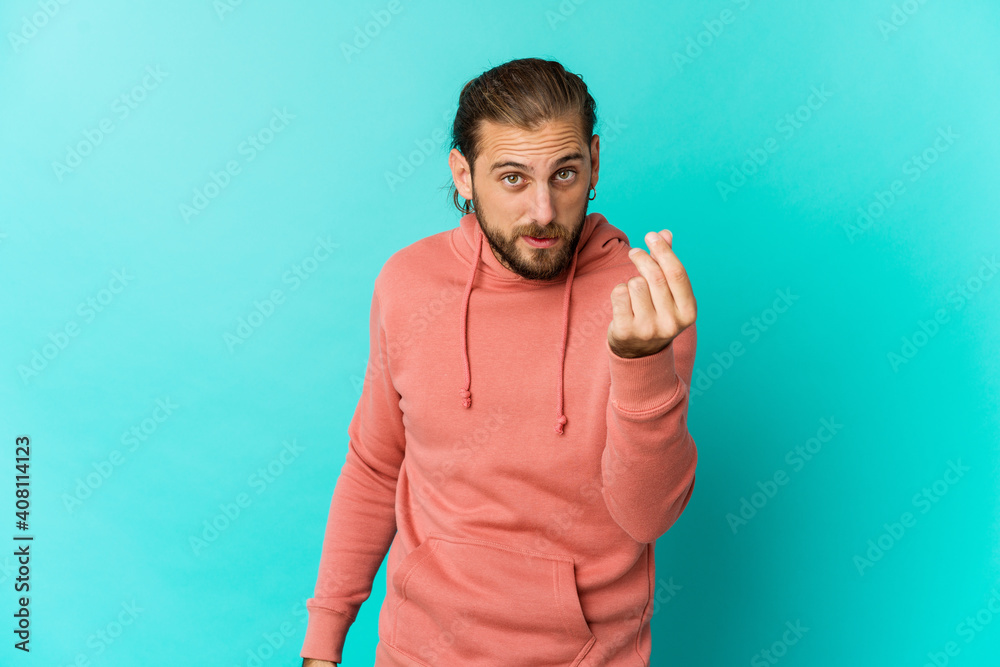 Young man with long hair look showing that she has no money. Young man with long hair look showing that she has no money.