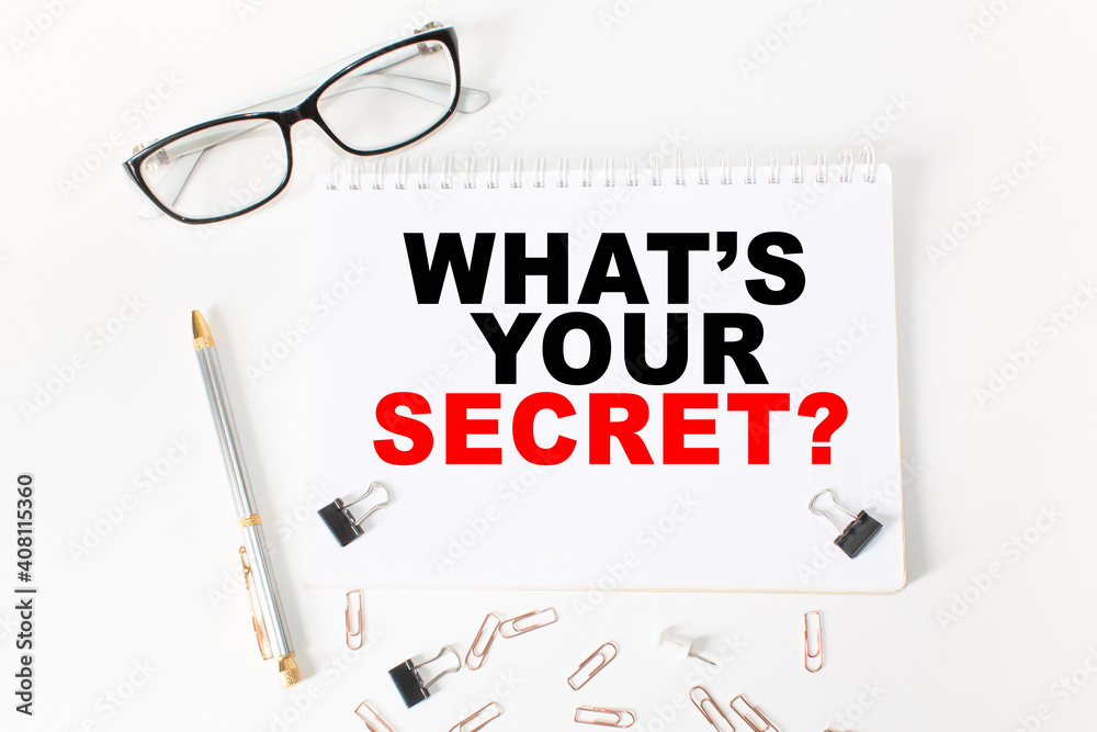 Notepad with inscriptions WHAT'S YOUR SECRET on a white background. business concept.