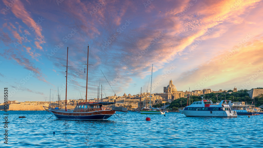 Boats at anchor in front of Valletta at sunset, Island of Malta