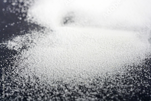 Makrogol powder photographed against a black background in the studio photo