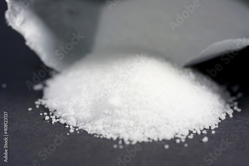 Obraz na plátně Makrogol powder photographed against a black background in the studio
