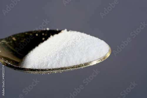 Makrogol powder photographed against a black background in the studio photo