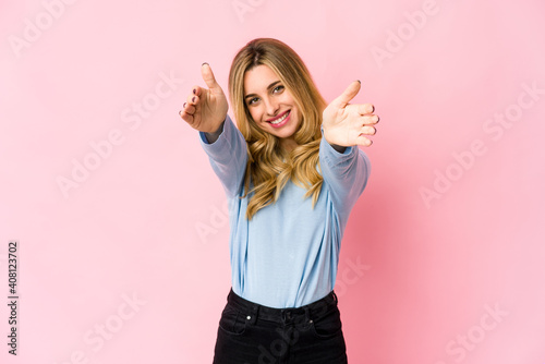 Young caucasian blonde woman cheerful and confident showing ok gesture.