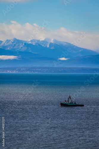 The Olympic mountains of Washington State with Puget Sound in the foreground.