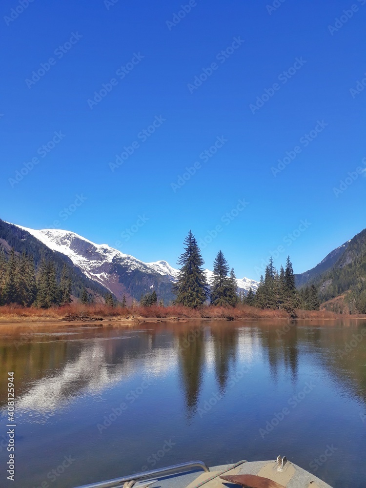 Landscape of a river with a mountain with snow in the top