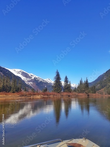 Landscape of a river with a mountain with snow in the top