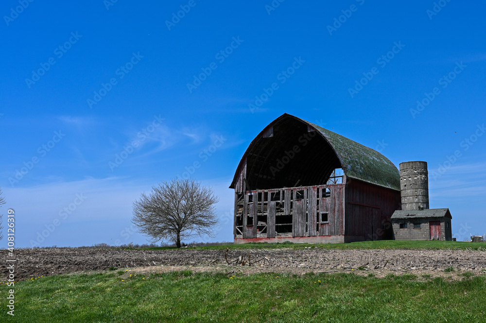 A dilapitated barn in springtime