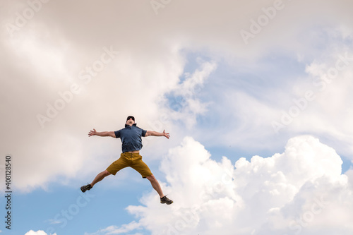 A man jumping against the sky