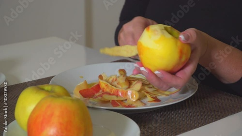 Woman peel apple