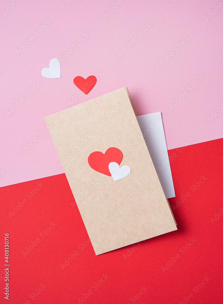 craft lenvelope with a red heart on a red and pink background. Concept of Valentine's day, mother's day, wedding day craft lenvelope with a red heart on a red and pink background. Concept of Valentine's day, mother's day, wedding day