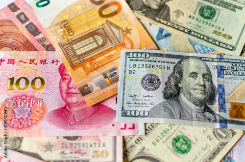 Background from different banknotes. Dollars, euros, yuan.