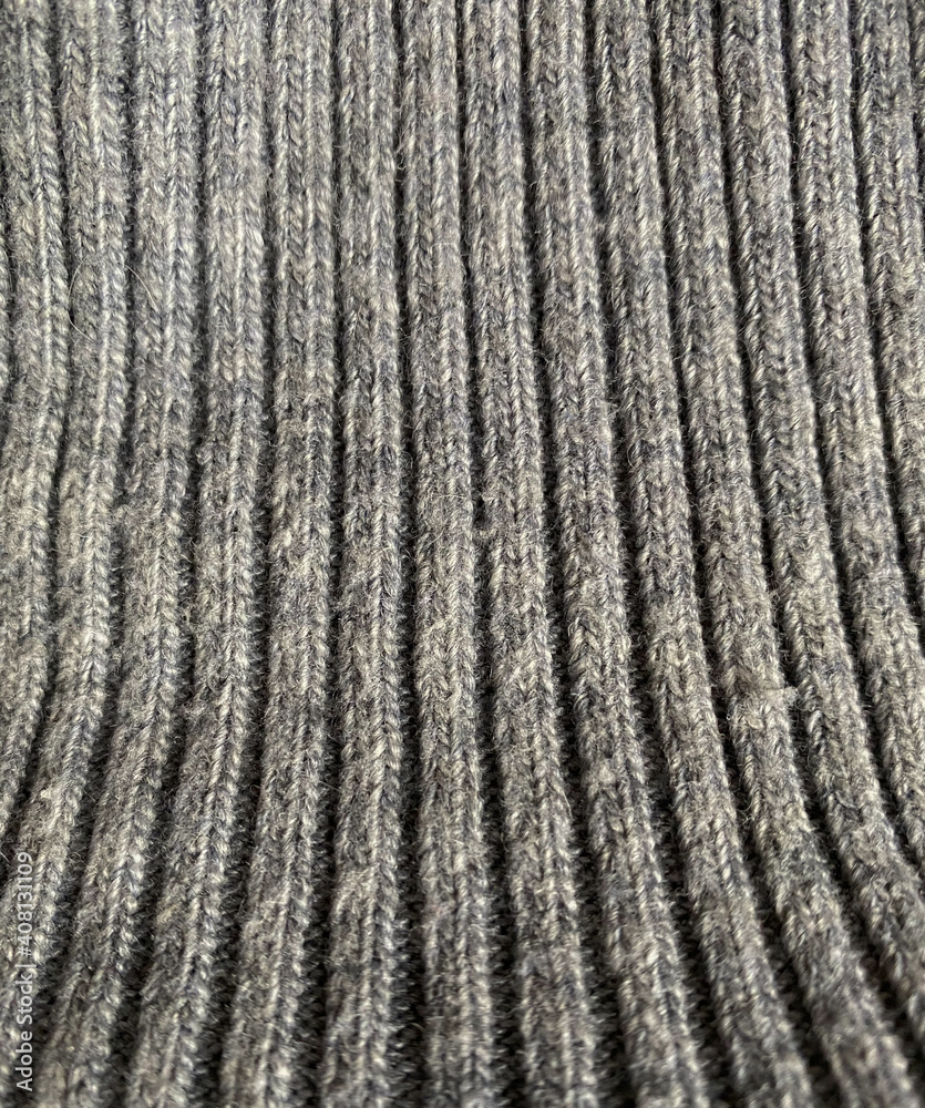Knitting, seams and furrows. Grey texture. Material Knitting, seams and furrows. Grey texture. Material