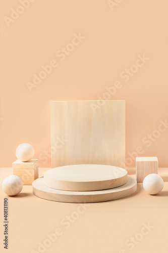 Wooden stands for product. Vertical mock up for design. Monochrome composition on beige background.