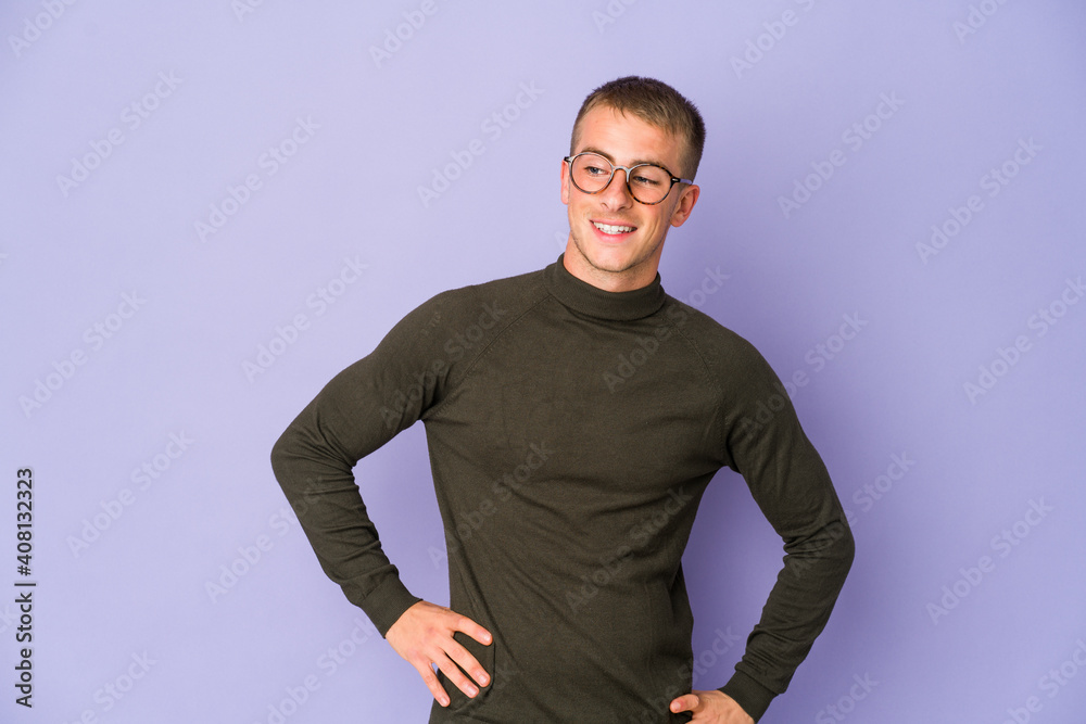 Young caucasian handsome man laughs and closes eyes, feels relaxed and happy. Young caucasian handsome man laughs and closes eyes, feels relaxed and happy.