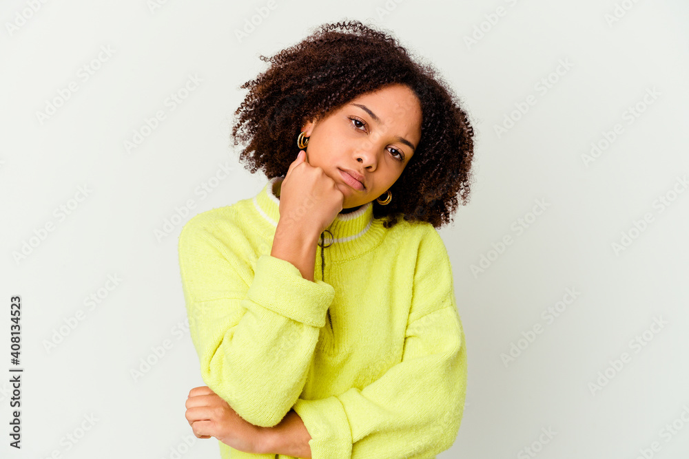 Young african american mixed race woman isolated tired of a repetitive task. Young african american mixed race woman isolated tired of a repetitive task.