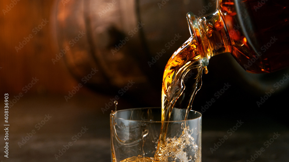 Whiskey Liquid falling into Glass, Freeze Motion. - obrazy, fototapety, plakaty 