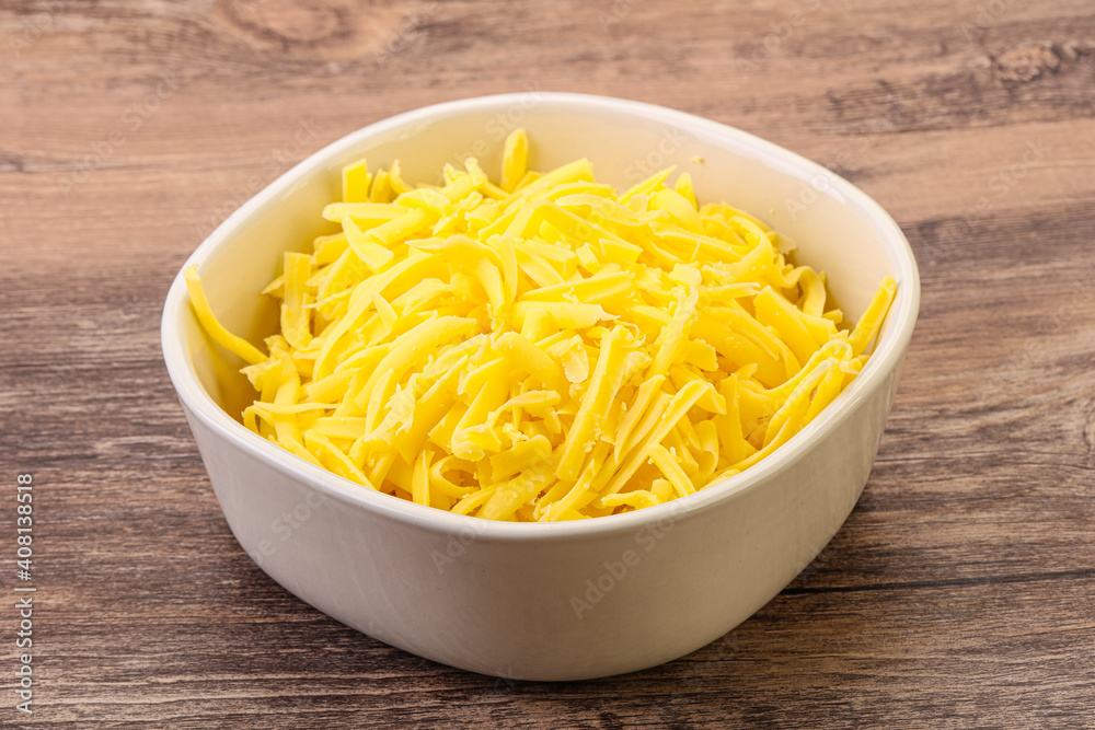 Shredded yellow cheese in the bowl Shredded yellow cheese in the bowl