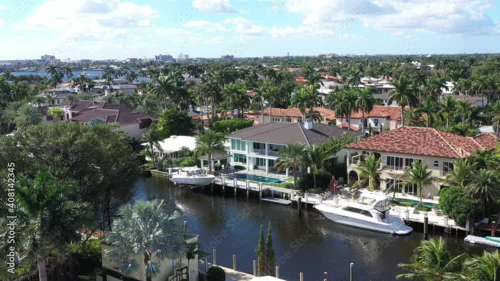 stylish waterfront mansions and sunny moderate tropical weather, aerial dolly out stylish waterfront mansions and sunny moderate tropical weather, aerial dolly out