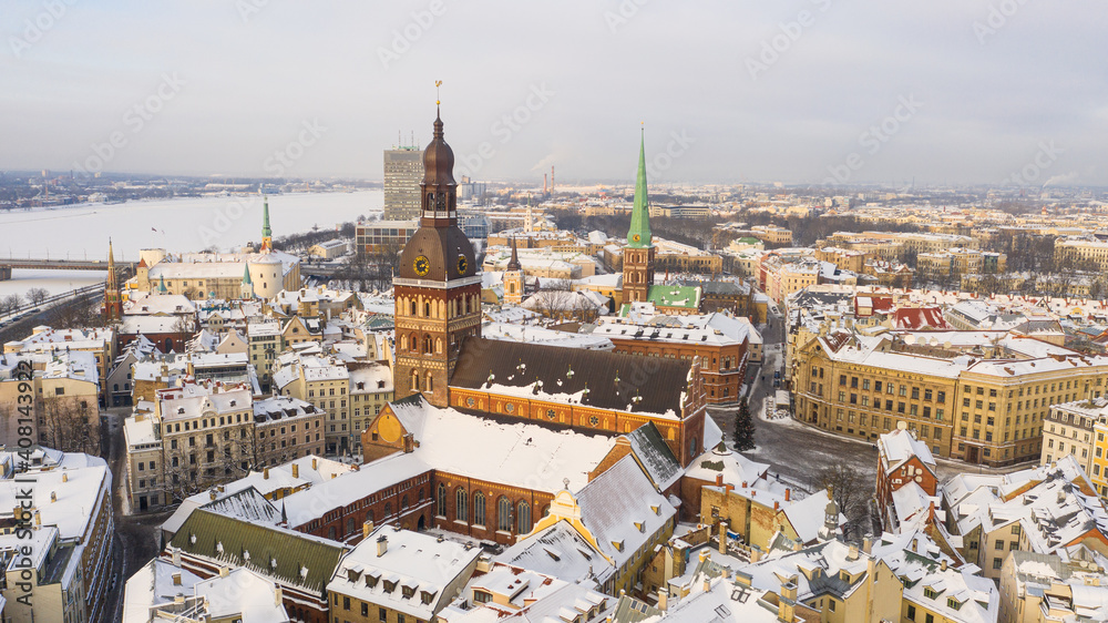 Riga, Latvia, Baltics. Beautiful panoramic aerial view photo from flying drone to Old Riga and Riga Dome Church on a Beautiful Sunny Winter Day. (series)