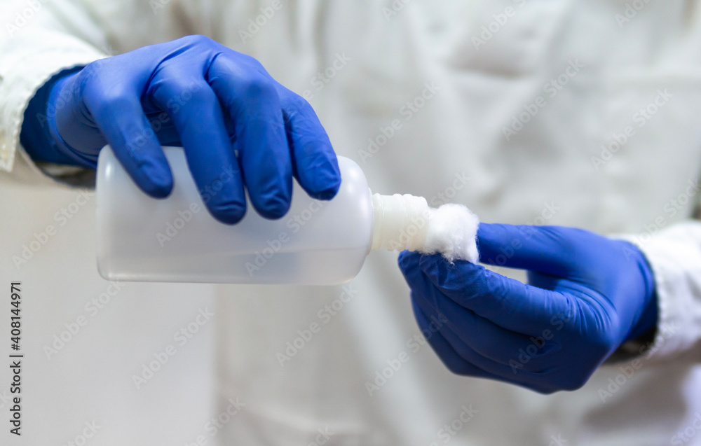 Doctor, nurse, scientist, researcher hand in blue gloves holding flu, measles, coronavirus, covid-19 vaccine disease preparing for human clinical trials vaccination shot, medicine and drug concept. Doctor, nurse, scientist, researcher hand in blue gloves holding flu, measles, coronavirus, covid-19 vaccine disease preparing for human clinical trials vaccination shot, medicine and drug concept.