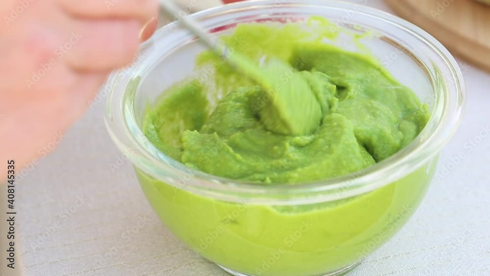 Vegetarian avocado sauce. Stir the mass in a bowl with a spoon Vegetarian avocado sauce. Stir the mass in a bowl with a spoon