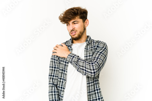 Young arab man on white background having a shoulder pain.