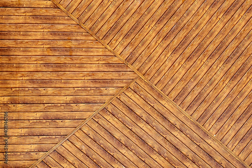 texture of a wooden wall with a geometric pattern of boards. background  close-up