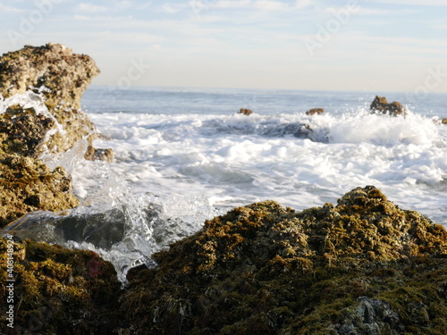 water hugs the rocks