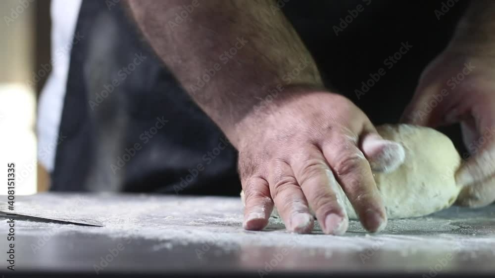 Man kneading dough with his hand, closeup video Man kneading dough with his hand, closeup video