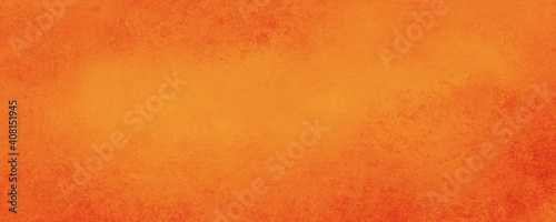 Orange background texture, halloween or autumn colors of red and golden orange colors, bright thanksgiving template, colorful bright website banner or header in distressed vintage textured design