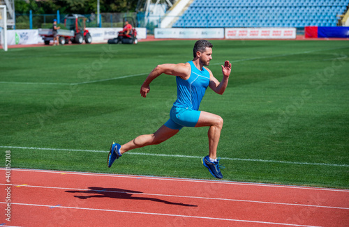 man runner on stadium running for exercise, stamina