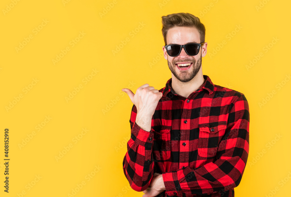 stylish guy with trendy hairstyle wear checkered shirt and glasses, accessory