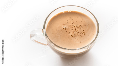 Glass cup of cappuccino on a white background