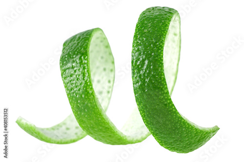Curly lime peel twist. Lime fruit peel isolated on a white background.