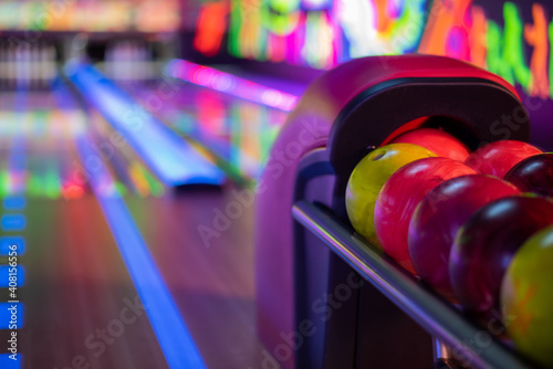 Tenpin balls with blurred alley in background photo