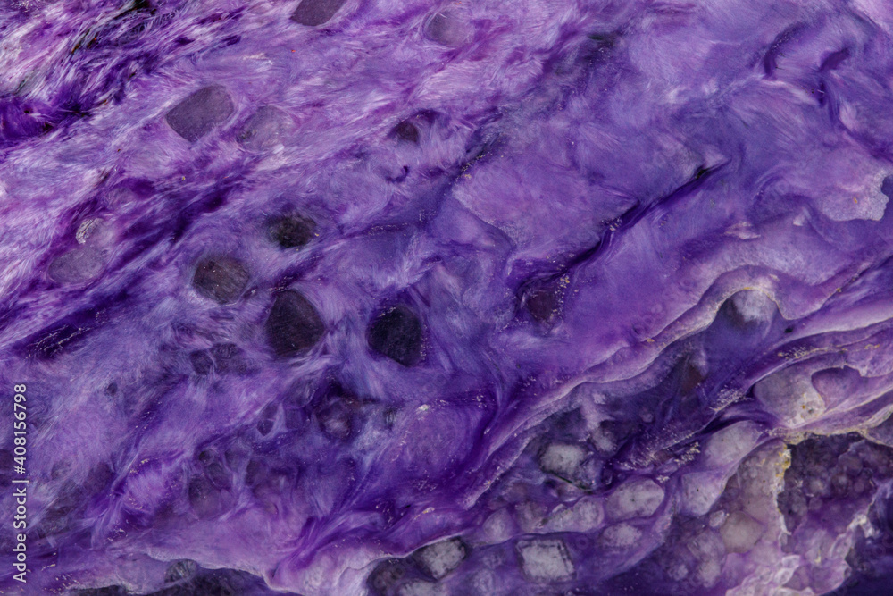 macro mineral stone Charoite on a white background macro mineral stone Charoite on a white background
