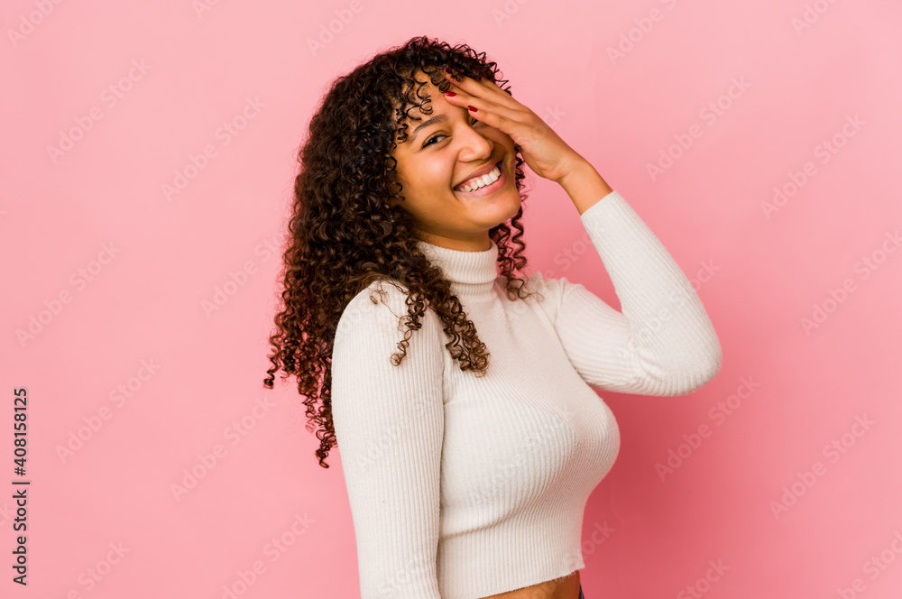 Young african american afro woman isolated laughing happy, carefree, natural emotion. Young african american afro woman isolated laughing happy, carefree, natural emotion.