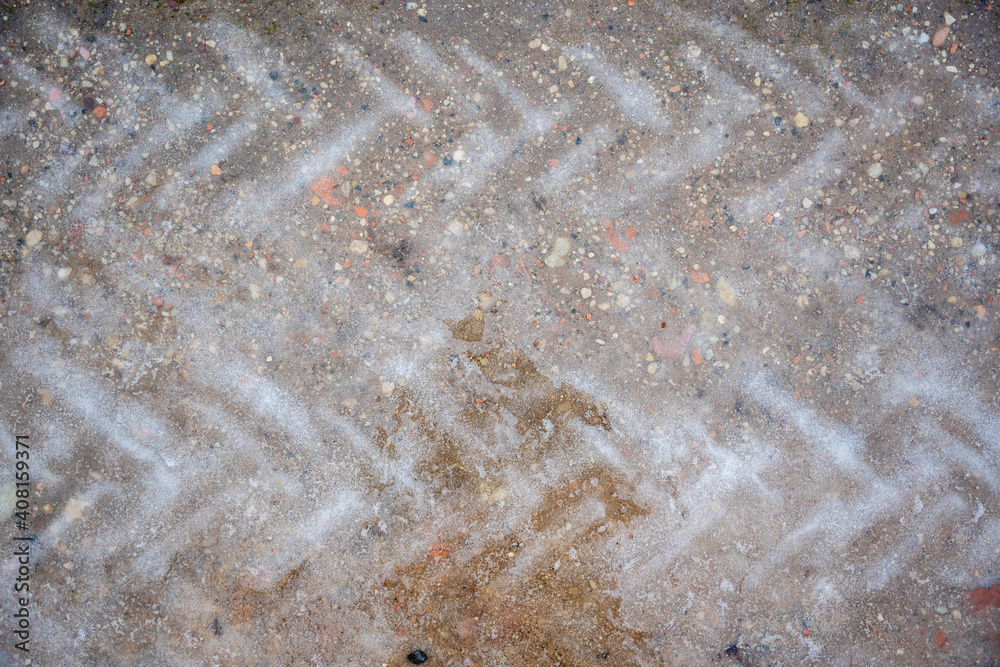 the tramline of the tractor tires is visible on wet ice the tramline of the tractor tires is visible on wet ice