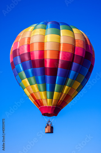 Multicolor Hot Air Balloon in Flight © Greg Meland