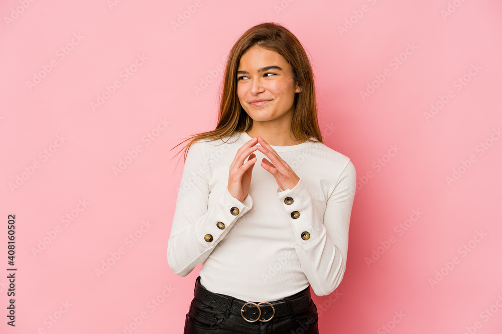 Young skinny caucasian teenager girl making up plan in mind, setting up an idea. Young skinny caucasian teenager girl making up plan in mind, setting up an idea.