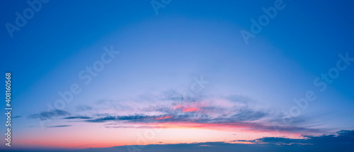 Romantic sunset sky background with beautiful clouds.