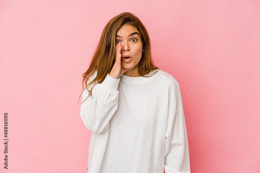 Young skinny caucasian teenager girl is saying a secret hot braking news and looking aside Young skinny caucasian teenager girl is saying a secret hot braking news and looking aside