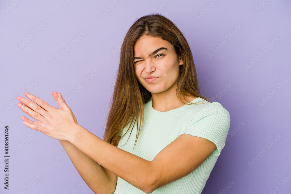 Young skinny caucasian girl teenager on purple background feeling energetic and comfortable, rubbing hands confident. Young skinny caucasian girl teenager on purple background feeling energetic and comfortable, rubbing hands confident.