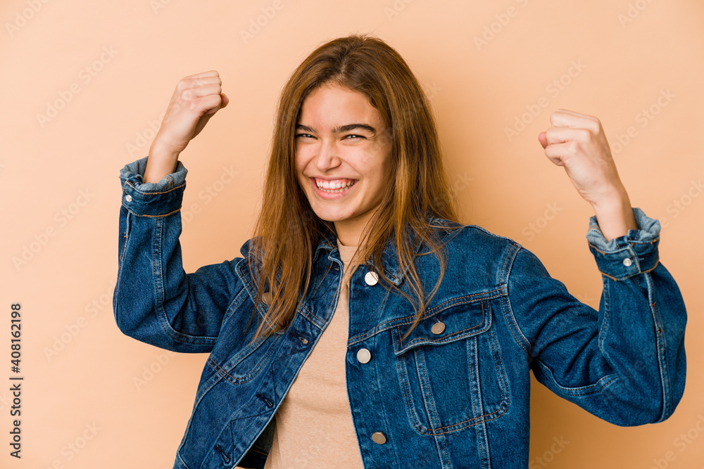 Young skinny caucasian teenager girl cheering carefree and excited. Victory concept.